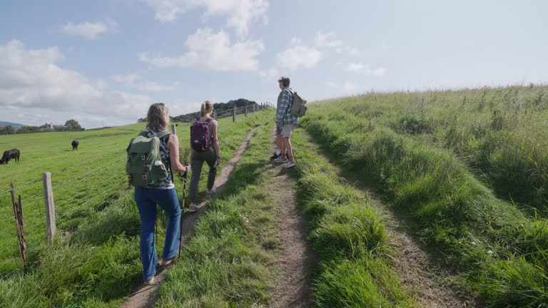 Family hiking on the sea cliffs of Jurassic Coast in Dorset, United Kingdom