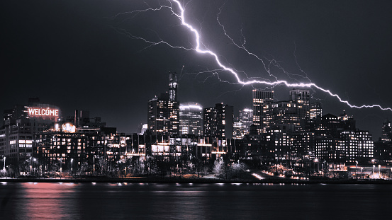 Brooklyn New York city skyline at night in a lightning storm