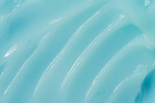 istock Blue cream, moisturizer, shampoo spread, sunscreen cosmetic smear background. Moisturizing beauty creme, balm swatch, paint texture. Creamy fluid skincare lotion mousse 1648888604