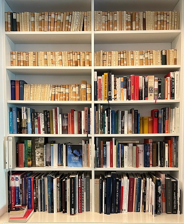 Library, white shelves, fully packed