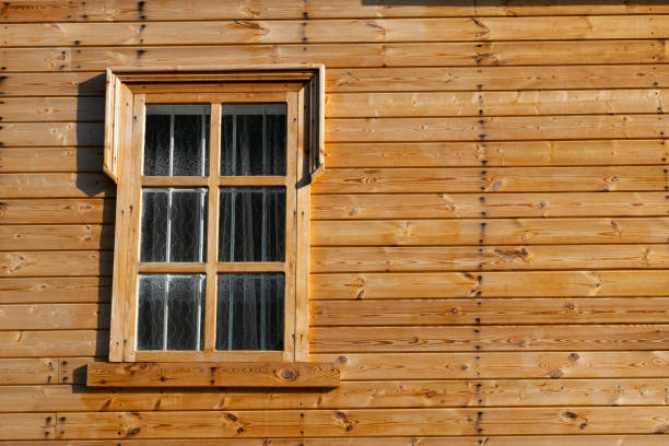Wall of wooden house with window, blank space for writing