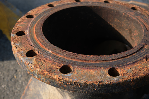 Close-up of an old rusty large shut-off valve for water supply.