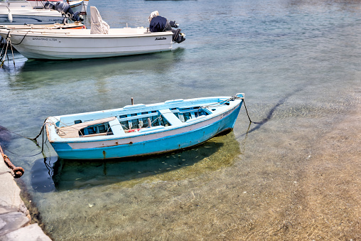 Mykonos, Greece - July 21, 2023: Vessels moored along the pier in Mykonos Town, Greece