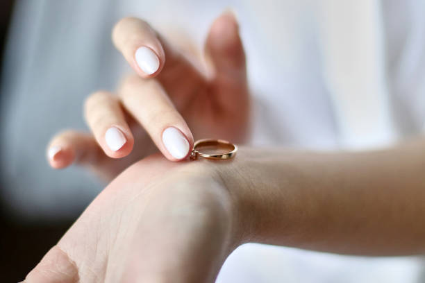 istock The bride holds a wedding ring in her hands while preparing for the wedding. Preparation and holding of the holiday. 1648924438