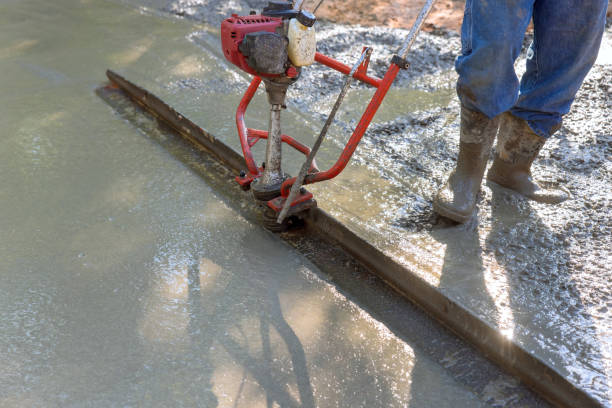 istock Tamping machine is used to align fresh concrete compacted layer for new driveway 1648929280