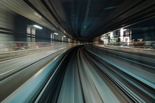 istock Motion blurred of train moving inside tunnel with daylight in tokyo, Japan. 1648931973