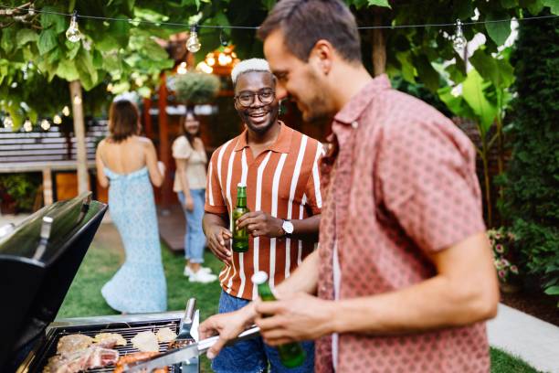 istock Happy friends having a barbecue party 1648938939