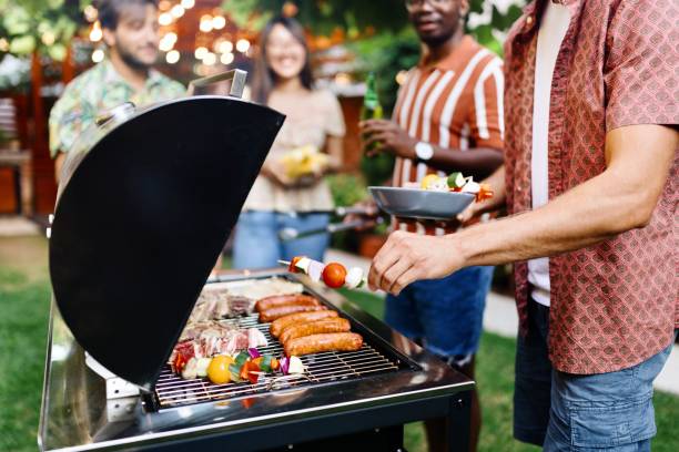 istock Close-up of people preparing a barbecue 1648940508