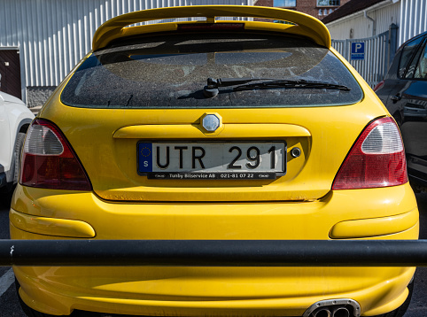 Borås, Sweden - May 28 2023: Rear badge of a yellow 2004 MG ZR 1.8.