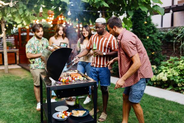 Barbecue party People having a barbecue party on a beautiful day bbq stock pictures, royalty-free photos & images