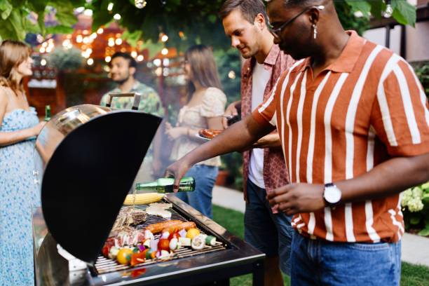 istock Multiracial man preparing a barbecue for his friends 1648941565