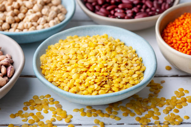 istock Different types of legumes in bowls - yellow lentils 1648942111