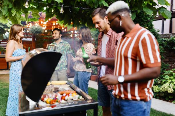 istock Black man preparing a barbecue for his friends 1648942116