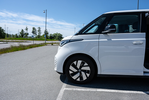 Gothenburg, Sweden - May 31 2023: Side view of a 2023 white Volkswagen ID Buzz electric van.