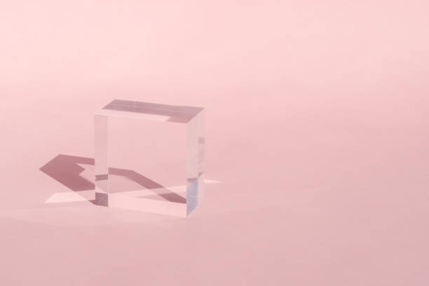 istock Acrylic block, podium for product presentation. Glass transparent cube with sun reflection, geometric stand for cosmetic, light and shadow on pink. Physics refraction effect 1648943737