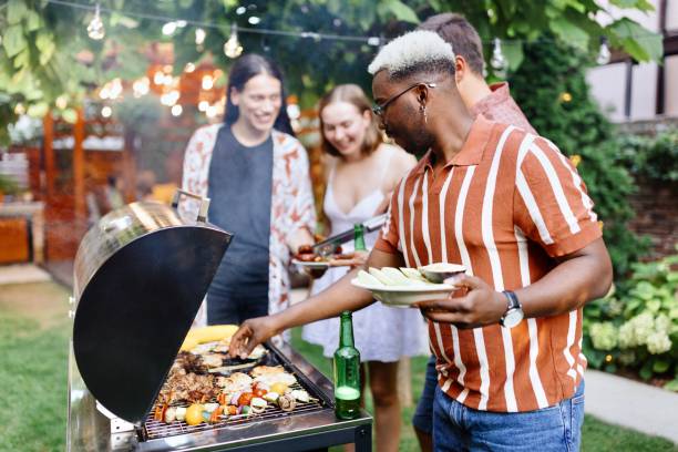 istock Lovely friends enjoying in the backyard 1648949137