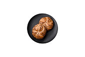 Delicious freshly baked crispy bun or kaiser roll with sesame seeds