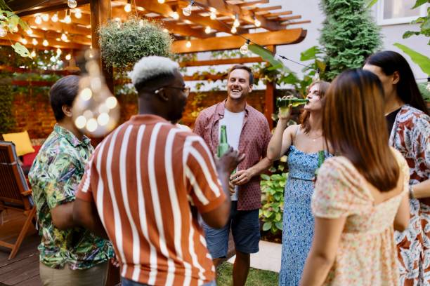 istock Friends drinking beer and talking in the backyard 1648953516