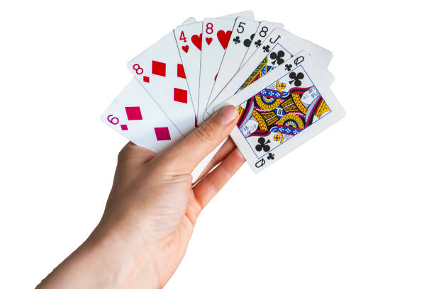 istock playing with cards close up isolated on white background 1648957298