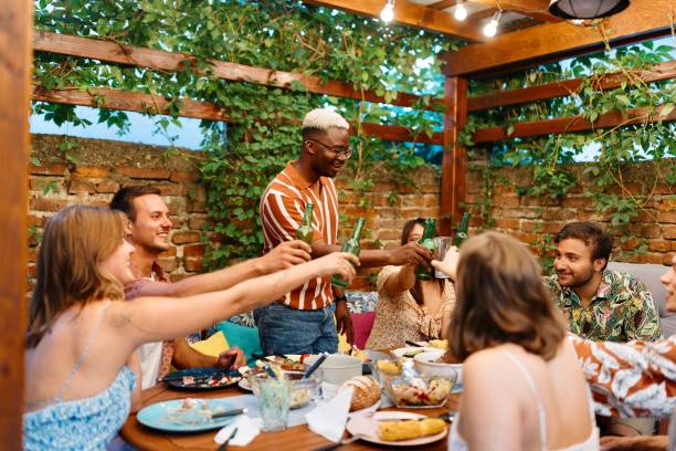 istock Multiracial friends making a toast in the backyard 1648961198