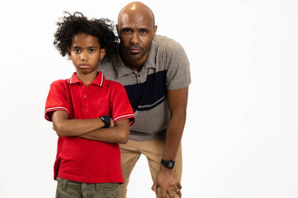 Single grandfather latino and grandchild play and have fun together spending quality family time on Father's Day celebrating victory with hugs and kisses