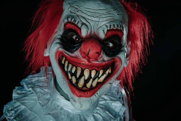 istock mad evil redhead clown staring at the observer 1649007128