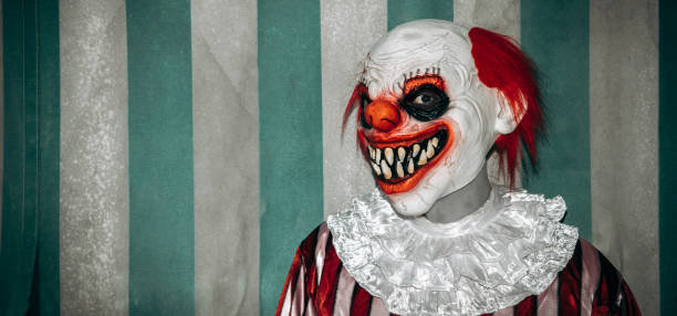 istock evil redhead clown in the circus, banner format 1649008230