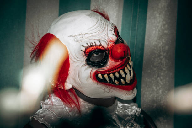 istock evil redhead clown smiles creepily in the circus 1649008755