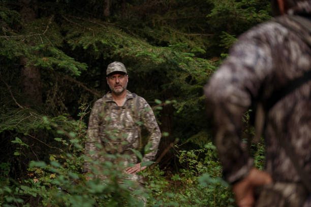 istock Two hunters hike at dawn while hunting elk 1649016293