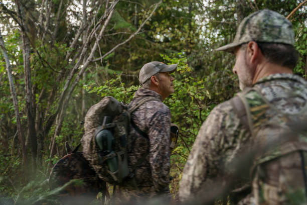 istock Two hunters hike at dawn while hunting elk 1649016307