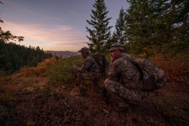 istock Two hunters hike, calling for elk wild game in Washington State 1649016846