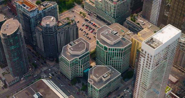 Iconic New York districts from above, showcasing bustling intersections with cars in motion. Experience the city's pulse as cars navigate through streets of these vibrant neighborhoods New York