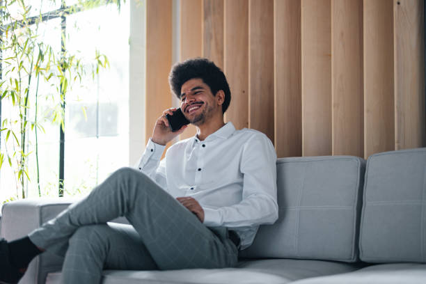 istock A Happy Handsome Businessman Talking On His Mobile Phone 1649045023