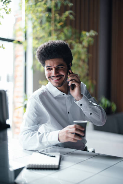 istock A Happy Handsome Businessman Drinking Espresso  While Talking On His Mobile Phone 1649045028