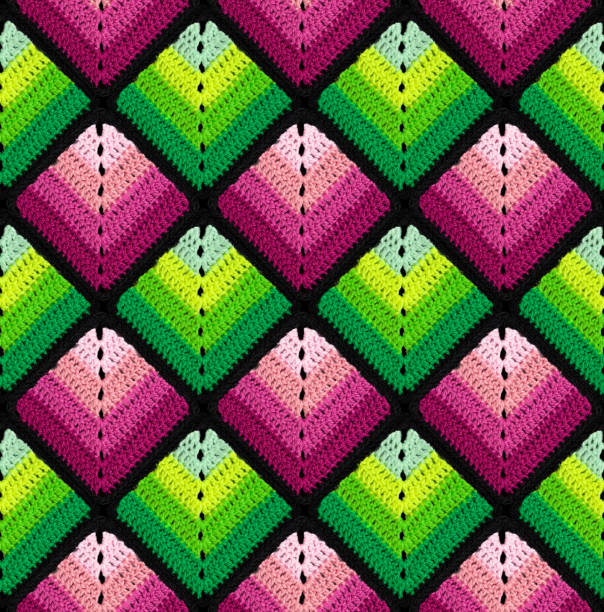 istock Seamless knitted pattern in the form of gradient rhombuses is crocheted with multi-colored threads. Patchwork style. 1649054347