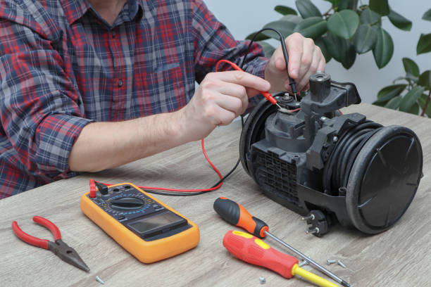 istock Vacuum cleaner disassembled for repair malfunctioning on work table. Small business. Serviceman is repairing modern vacuum cleaner in his office. 1649054396