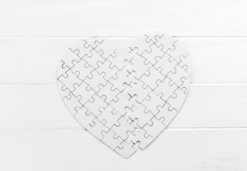 Bold heart shaped puzzle on white table