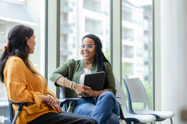 istock Cheerful counselor listening to patient 1649072438