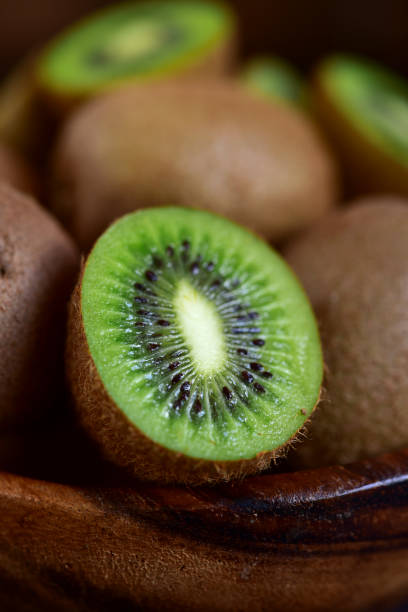 istock Fresh kiwi in a wooden bowl. 1649081276