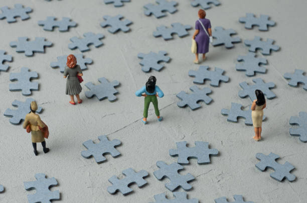 Puzzle: Women's Issues 2 Female figures looking at scattered puzzle pieces research ethics stock pictures, royalty-free photos & images