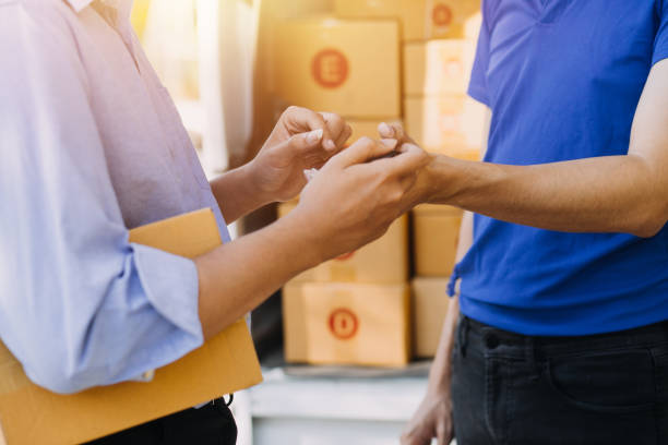 istock Blue Delivery Men Unloading Package From Truck With Face Mask 1649101635