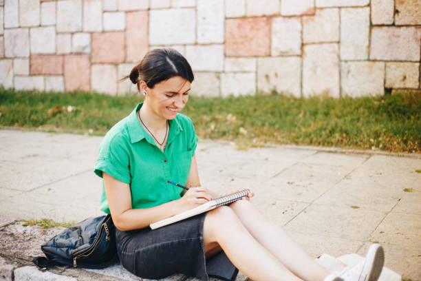 istock Young woman drawing outdoors stock photo 1649102775