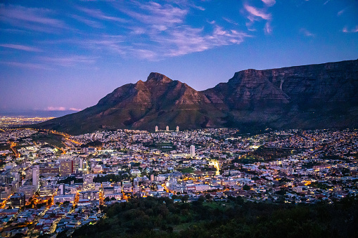 Scenic view of the city of Cape Town against the backdrop of Table Mountain at sunset in summer