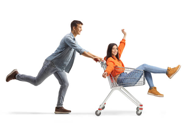 istock Boyfriend pushing girlfriend inside a shopping cart 1649118412