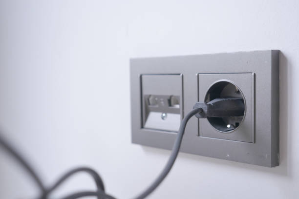 istock white color power cord cable plugged into wall 1649122762