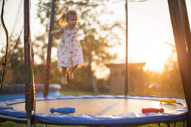 istock Little girl jumping on a trampoline 1649131815