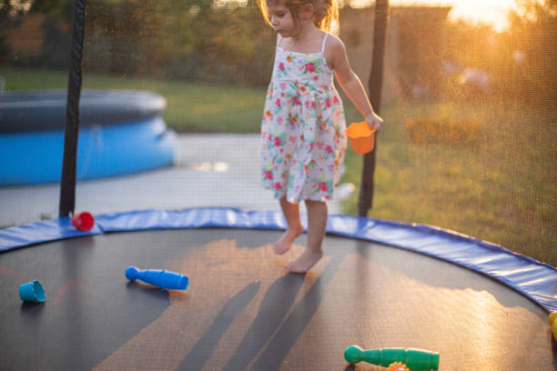 istock Little girl playing on a trampoline 1649131827