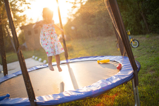 istock Little girl jumping on a trampoline 1649132357