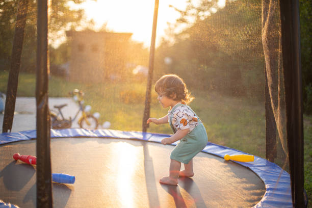 istock Little boy playing on a trampoline 1649133460