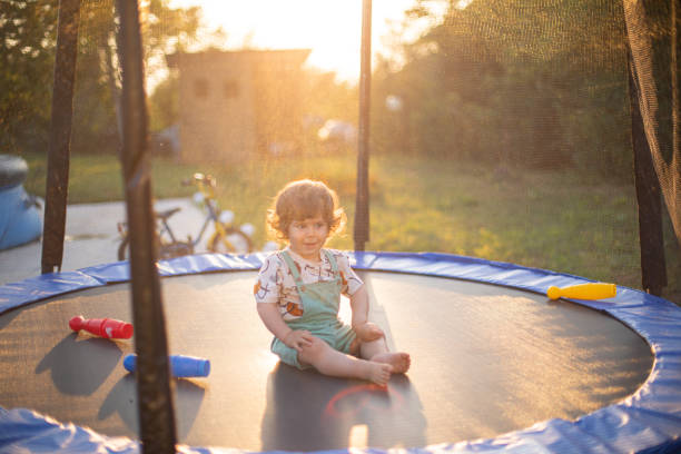 istock Little boy playing on a trampoline 1649133805